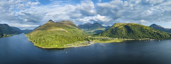 Aerial panorama of the freshwater loch Loch Leven with the village of Glen Coe, above it the 742