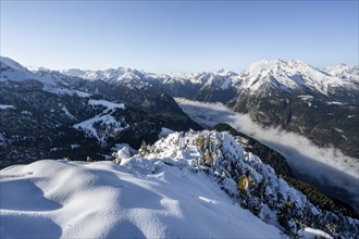 Snow-covered summit of the Jenner with viewing platform in autumn, view of the sea of clouds and