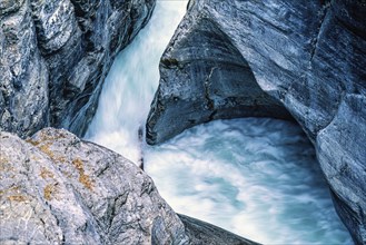 Running water in a canyon between the rock faces from above, Jasper National Park, Canada, North