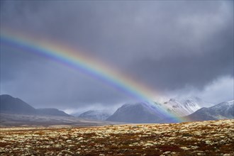 Rainbow in autumnal mountain landscape, Rondane National Park, Norway, Europe