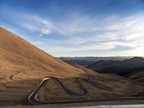 Winding roads in the Tibetan high mountains, Tibet, China, Asia