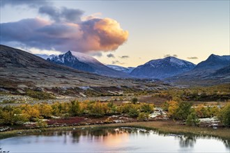 Mountains and lake in autumnal mountain landscape, Rondane National Park, Norway, Europe