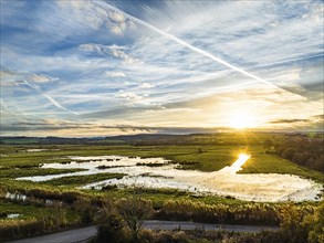 Sunset over Wetlands and Marshes in RSPB Exminster and Powderham Marshe from a drone, Exeter,