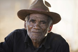 Close up portrait of Malagasy old man with hat in Bekopaka, Antsalova, Melaky, Madagascar,