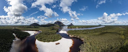 Black river and white sand beach before the granite hills, Cerros de Mavecure, Eastern Colombia