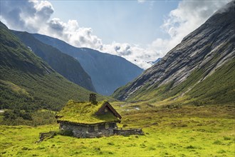 Traditional cottage with grass roof in mountain valley, Skjerdingsdalssaetra, Stryn, Norway, Europe