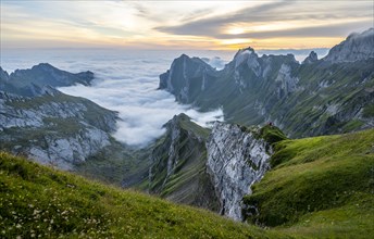 View over SÃ¤ntis mountains into the valley of Meglisalp at sunrise, Rotsteinpass, high fog in the