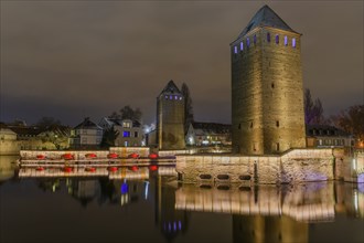 The twin watchtowers of the Ponts Couverts were illuminated at night at Christmas. Strasbourg,