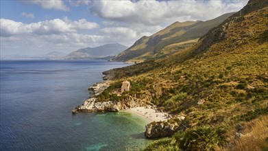 Cloudy weather, coastline, green coastal mountains, small bay, pebble beach, bathers, Zingaro,