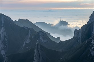 Sunrise over ridge in Alpstein, high fog in valley, SÃ¤ntis, Appenzell Ausserrhoden, Appenzell