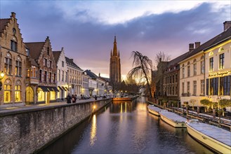 Canal and Church of Our Lady at dusk, Bruges, Belgium, Europe