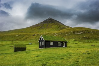 Lonely grass roofed house in Gjogv, Estuyroy, Faroe islands, Denmark, Europe