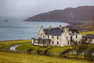 Old building on the Isle of Skye, the sea in the background