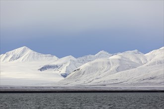 Snow covered mountains at Billefjorden, central fjord of the Isfjorden, Svalbard, Spitsbergen,