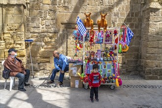 Little boy in front of a stall with toys in Nicosia, Cyprus, Europe