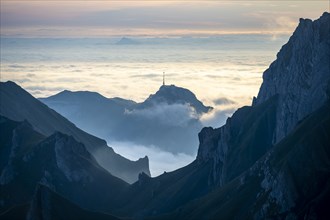 Hoher Kasten and mountains at sunrise, high fog in the valley, view from SÃ¤ntis, Appenzell