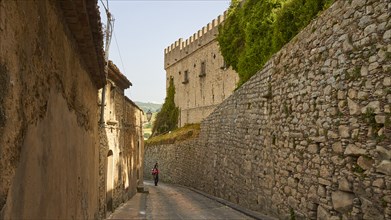 Narrow high alley, tower with battlements, walls, Montalbano Elicona, town, Nebrodi National Park,