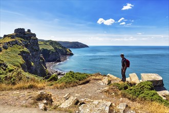 South West Coast Path, walkers on coastal path, Valley of the Rocks, rocky coast in Exmoor National