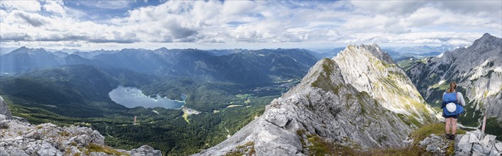 Alpine panorama, hiker, view of Eibsee lake and Werdenfelser Land, Wetterstein Mountains,