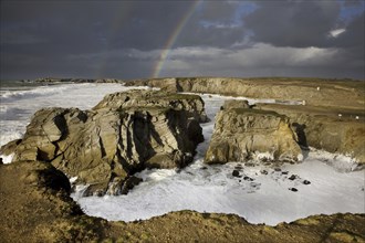 Rainbow during storm at sea, Côte Sauvage, Quiberon, Brittany, France, Europe