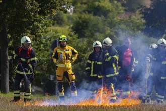 During controlled field fires, the firefighters were able to test various extinguishing methods,