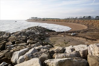 Rock armour boulders used as coastal defence against rapid erosion at East Lane, Bawdsey, Suffolk,