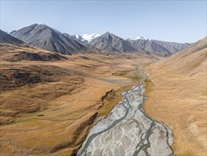 Aerial view, Burkhan mountain valley with meandering river, barren dramatic mountain landscape,