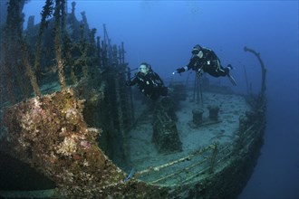 Divers at the stern of the Maldive Victory wreck, Hulhule, North Male Atoll, Maldives, Asia