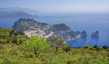 View from Monte Solaro 589m to the south coast with the Faraglioni rocks, the island's landmarks,