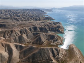 Barren landscape, aerial view, erosion landscape with canyons on the Naryn River, Toktogul