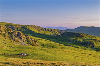 View of the mountains of the Transylvanian Alps in the southern Carpathians from a height in the