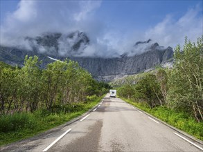 Steep granite cliffs at the road to Nusfjord, narrow single track road, Nusfjord, Flakstadoy,