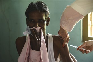 Beneficiaries receives dose of COVID-19 coronavirus vaccine in a vaccination centre at a village in