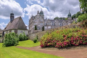 Garden with St. Mary's Castle Church and HÃ¤melschenburg Castle, Weser Renaissance castle,