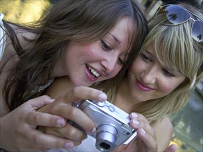 Two woman taking a selfie with the camera, Barcelona, Spain, Europe