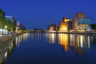 The inner harbour, Duisburg, former mills and warehouse buildings, modern office buildings, left,