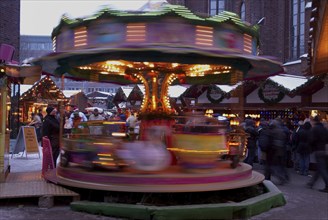 Europe, Germany, Hamburg, Christmas market in front of St Peter's Church, Children's carousel,