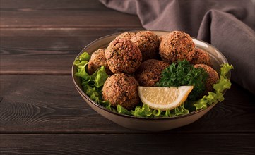 Chickpea falafel balls, on a wooden table, close-up, vegetarian food