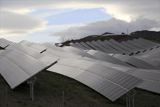 Array of solar panels on a grey overcast day, Sierra Alhamilla, near Nijar, Almeria, Spain, Europe