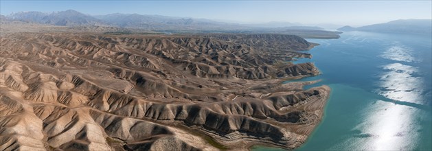 Barren landscape, aerial view, erosion landscape with canyons on the Naryn River, Toktogul