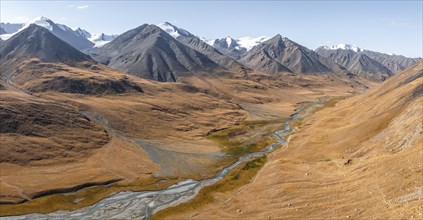 Aerial view, Burkhan mountain valley with meandering river, barren dramatic mountain landscape,