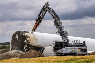 Demolished tower of a 20 year old wind turbine, in the Werl wind farm, 5 old Enercon E-66 turbines