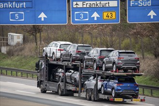 A5 motorway, car transporter with various new VW cars, passenger car