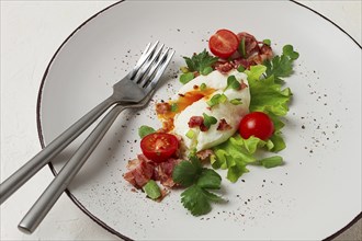 Poached egg, with bacon and vegetables, breakfast, homemade