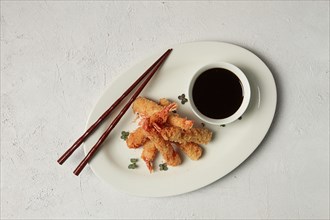 Fried shrimp, peeled in tempura, soy sauce, close-up