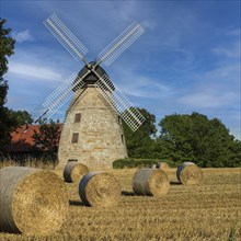 Historic windmill with straw bales Rodenberg Germany