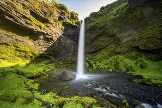 Kvernufoss waterfall, in summer when the weather is fine, gorge and river, long exposure, Skogar,