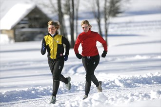 Running in the snow, man, 35, 40, years, running, running, snow, winter, two woman