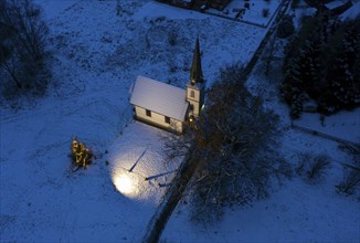 A Christmas tree stands in front of the smallest wooden church in Germany, Elend, 29 December 2020