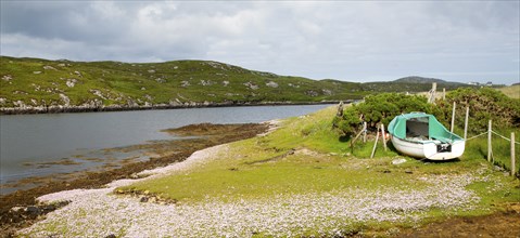 Small fishing boat on the east coast of Barra, Outer Hebrides, Scotland, UK